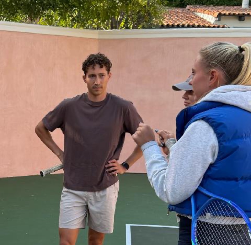 Stefania coaching a client at a private court